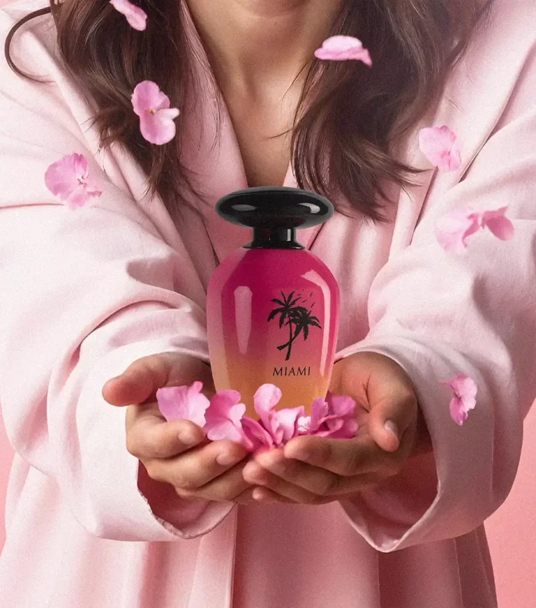Perfume Manufacturers in UAE | Custom Private Label Perfume Factory Since 1978 3 Young woman holding our exclusive Night De Paris Miami perfume, a signature fragrance crafted and packaged by 3F Perfumes.