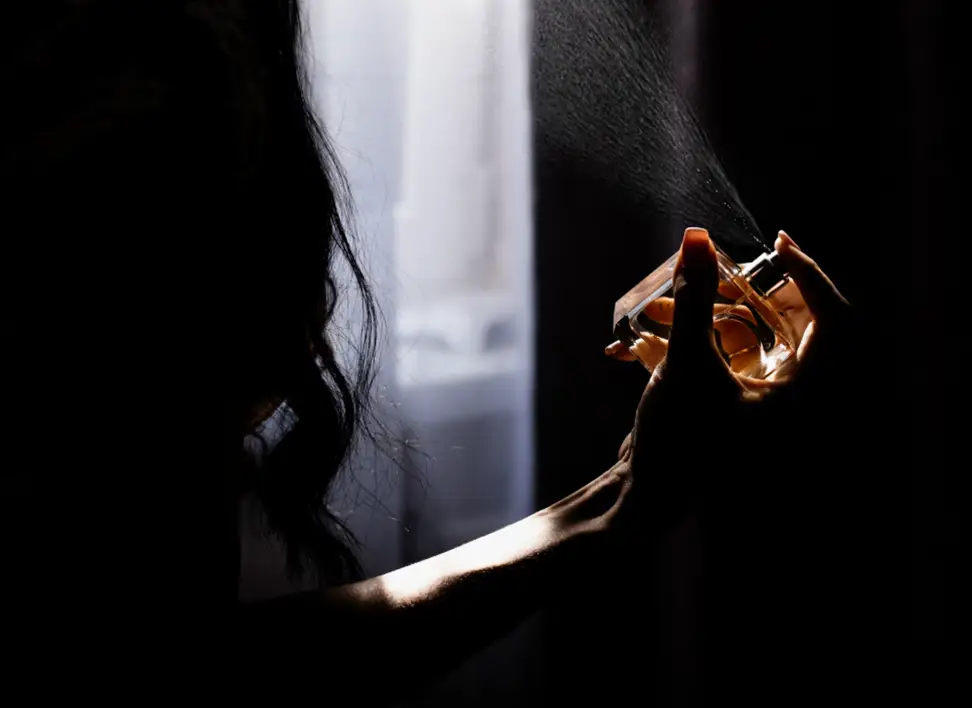 Custom Perfume Development 7 Close-up of perfume being sprayed, symbolizing our expertise in custom fragrance development.